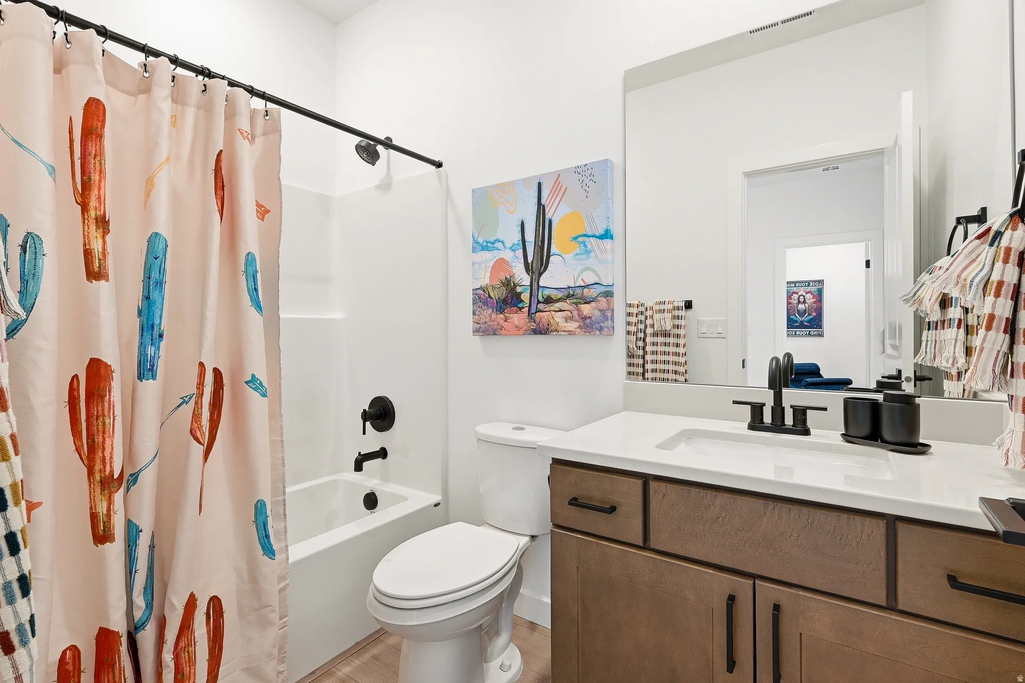 Full bath featuring vanity and shower / bathtub combination with curtain