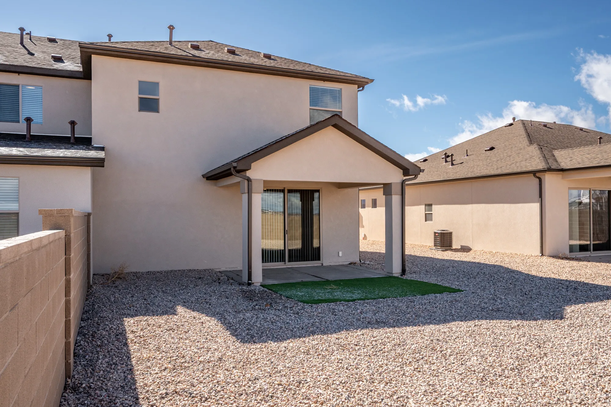 Back of house featuring a patio area and stucco siding