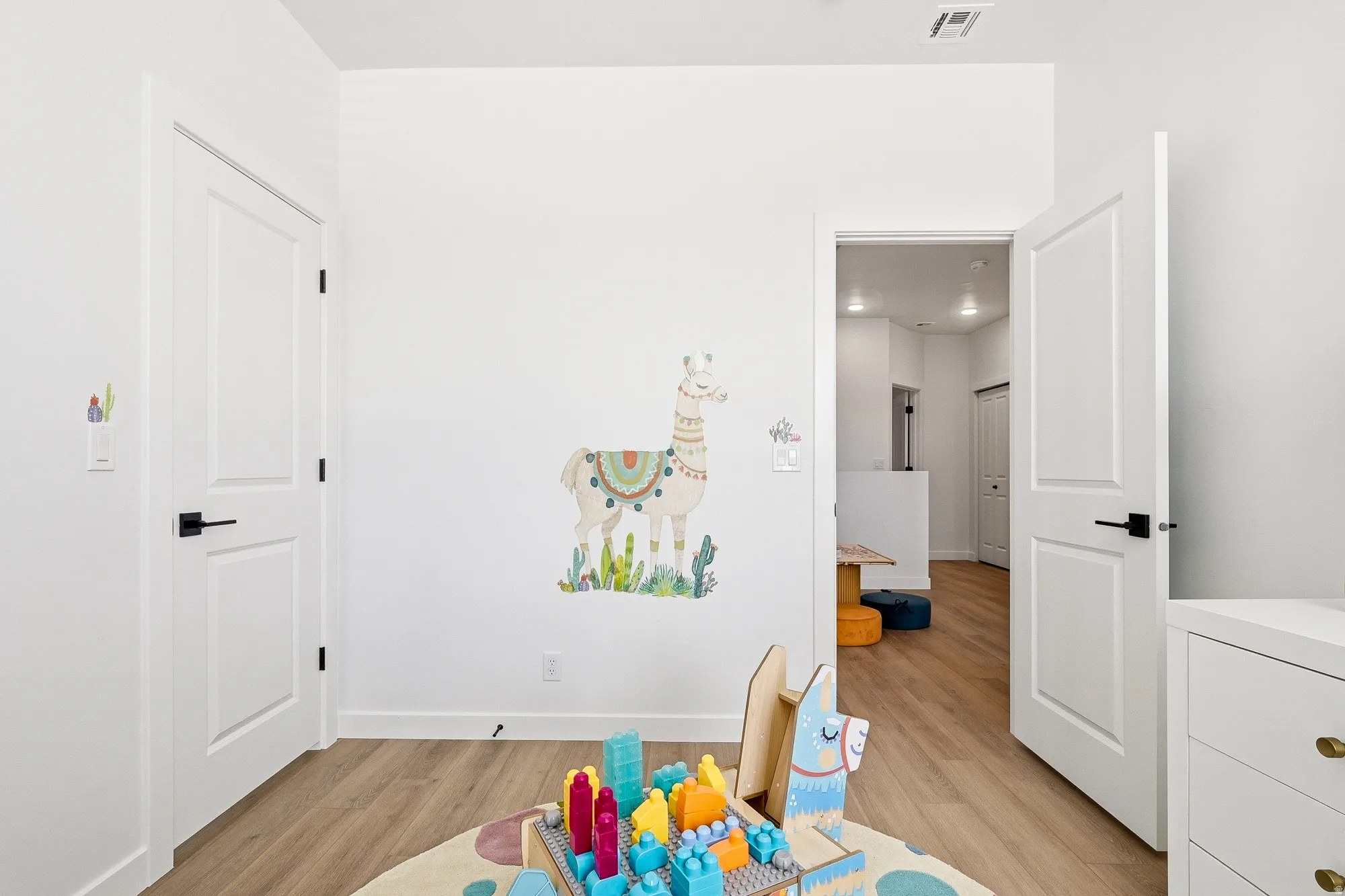 Game room featuring baseboards and light wood-style floors