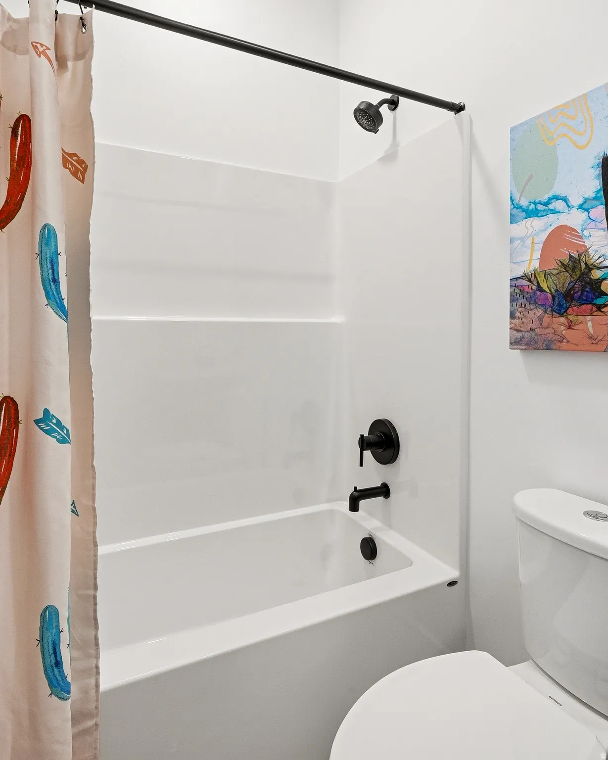 Full bath with toilet and shower / bathtub combination with curtain