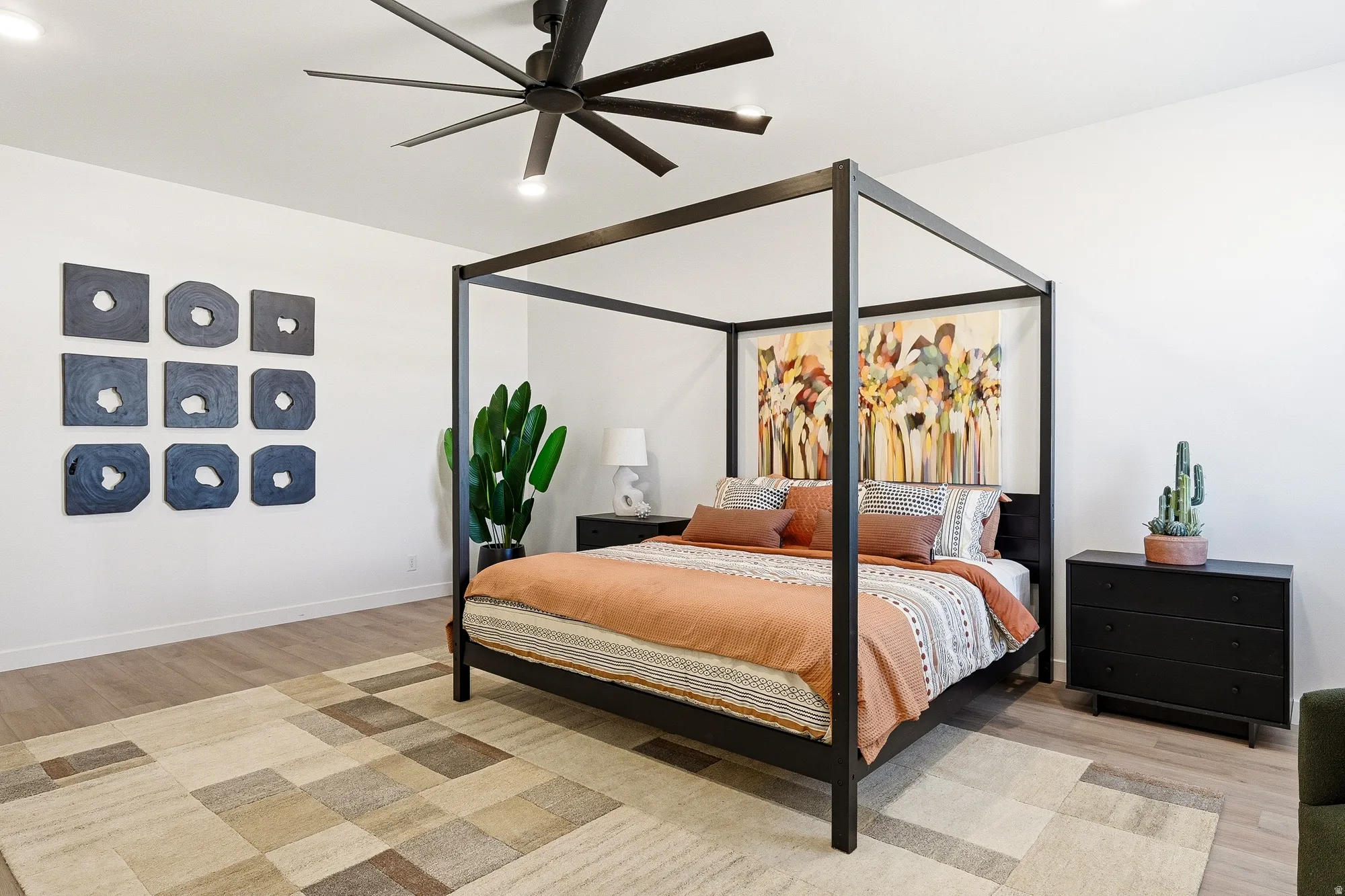 Bedroom with light wood finished floors, a ceiling fan, and recessed lighting