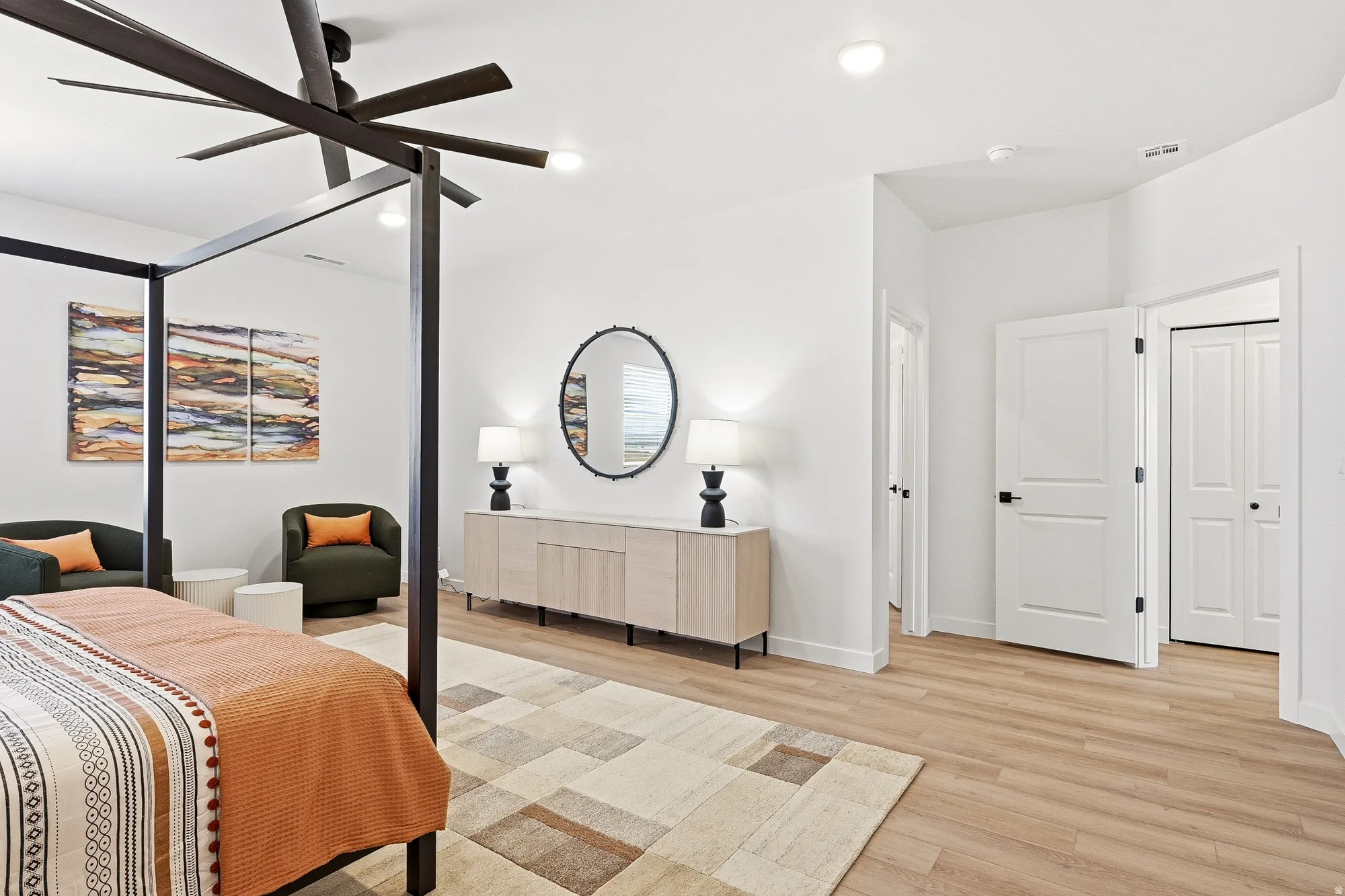 Bedroom with light wood finished floors, a ceiling fan, and recessed lighting