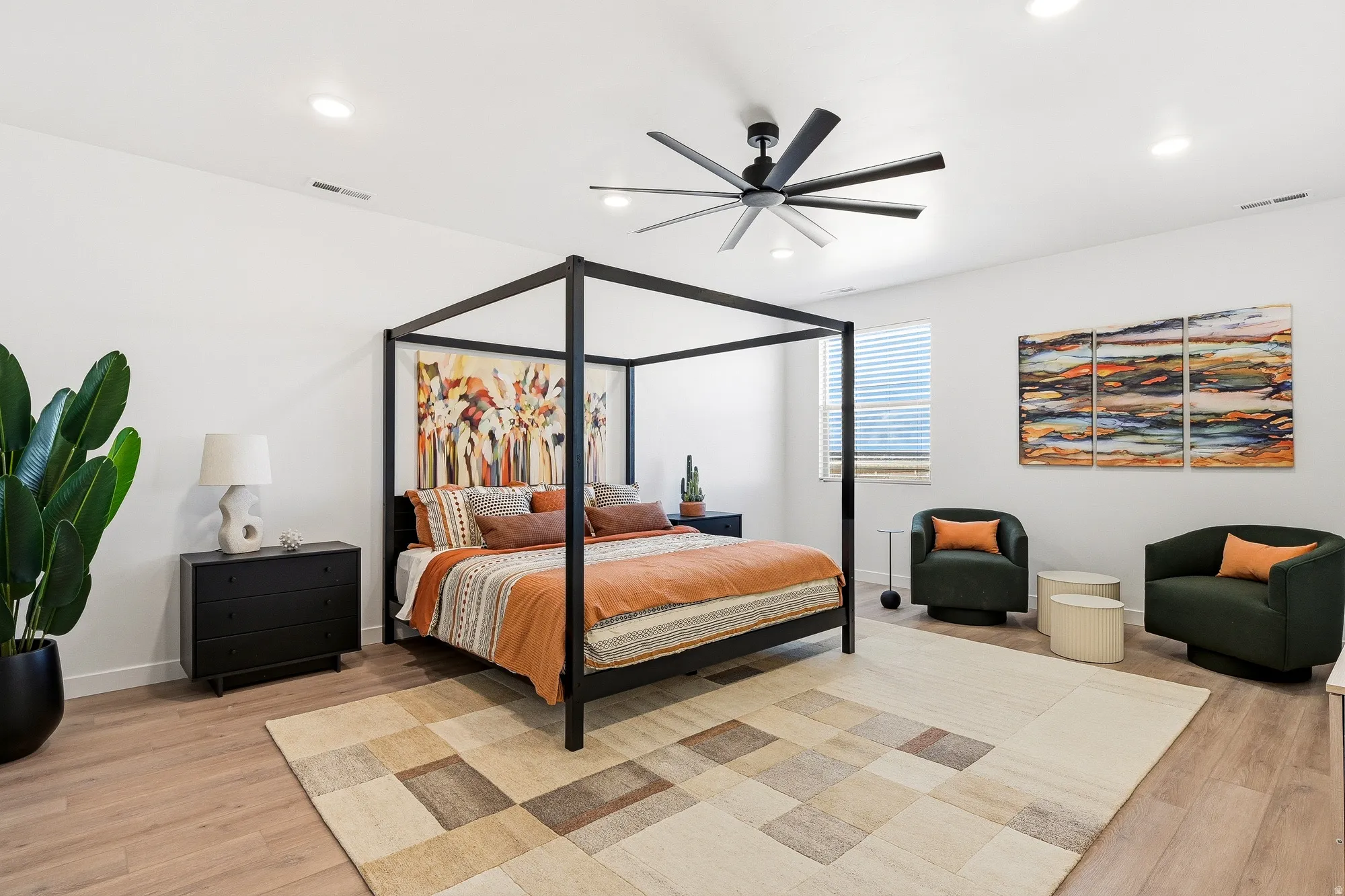 Bedroom featuring light wood-type flooring, a ceiling fan, and recessed lighting