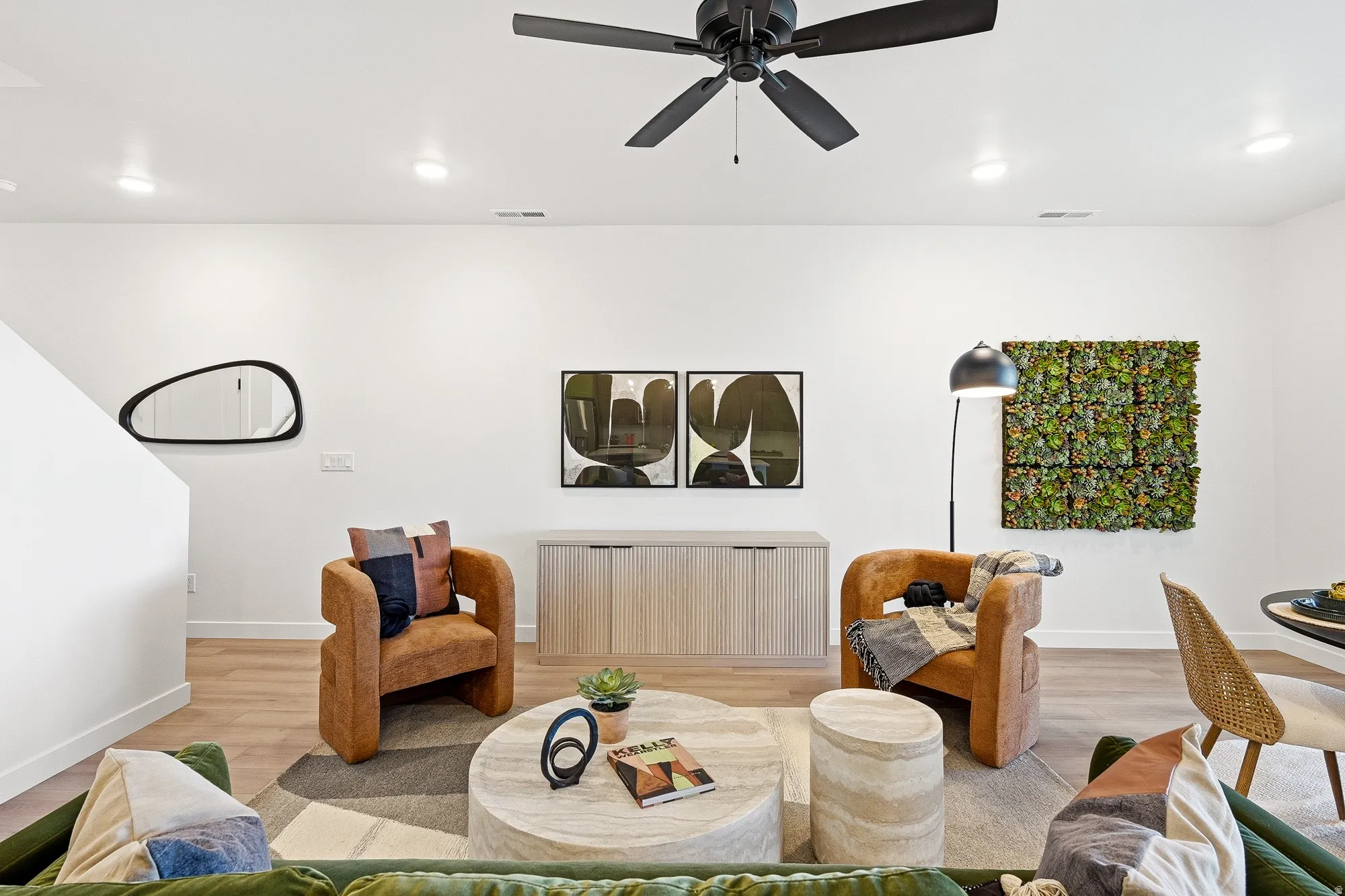Living area featuring light wood-style floors, recessed lighting, and ceiling fan