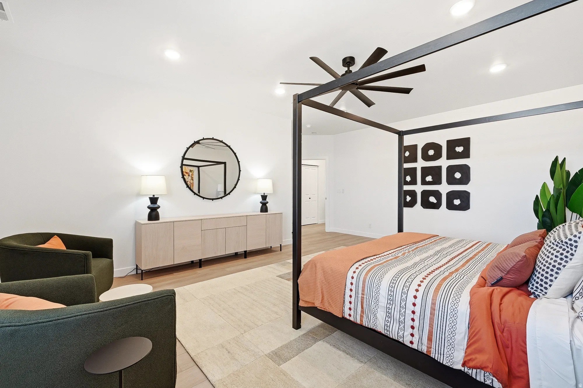 Bedroom featuring light wood finished floors, ceiling fan, and recessed lighting