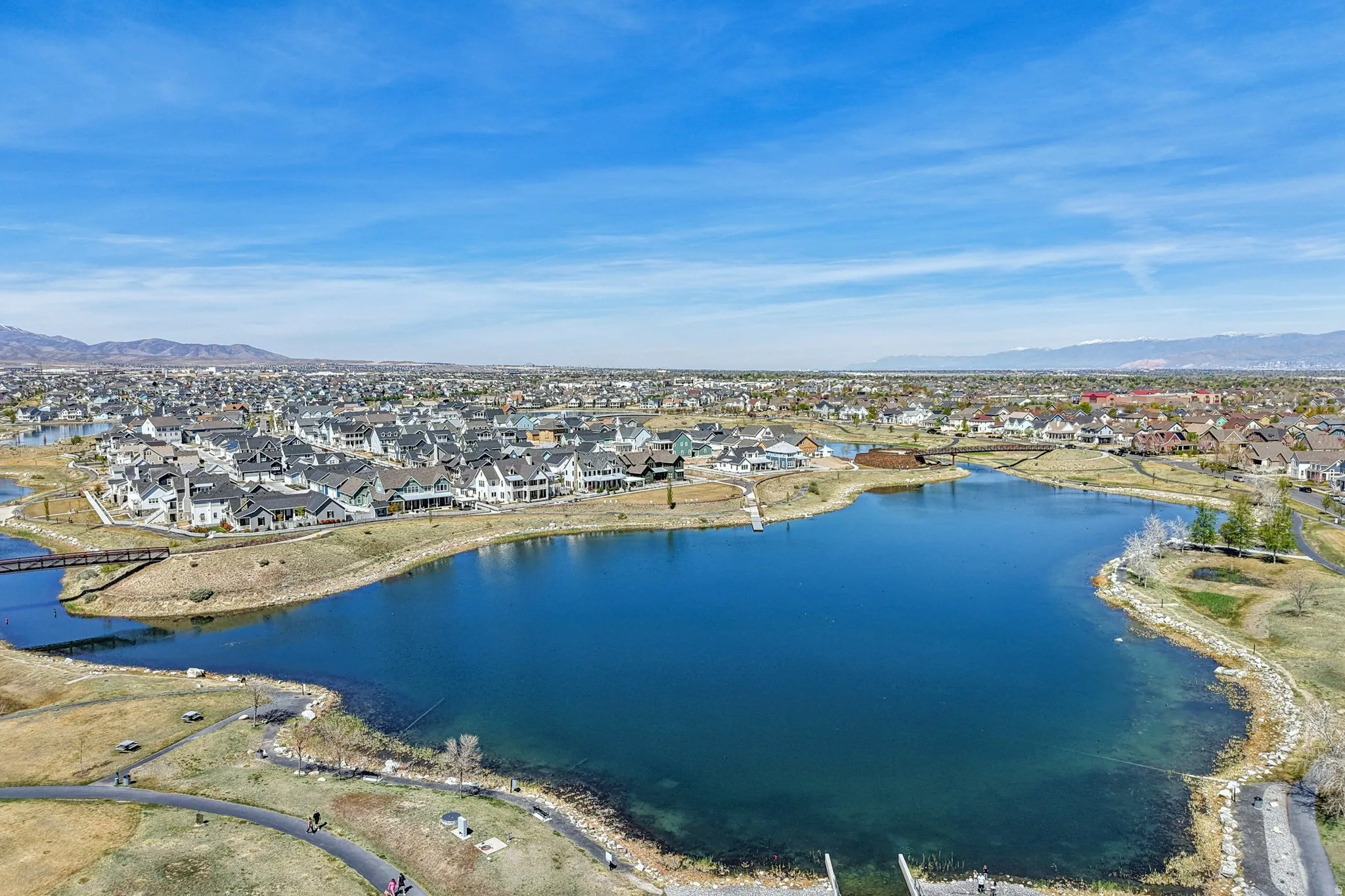 Aerial perspective of suburban area featuring a water and mountain view