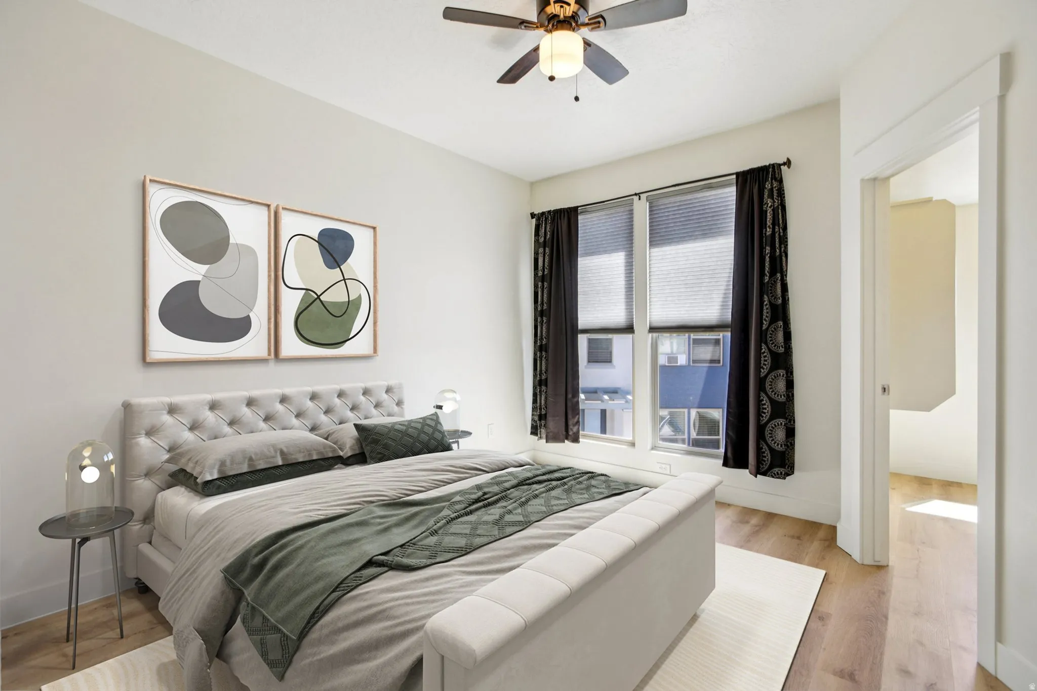 Bedroom featuring light wood-style floors and ceiling fan