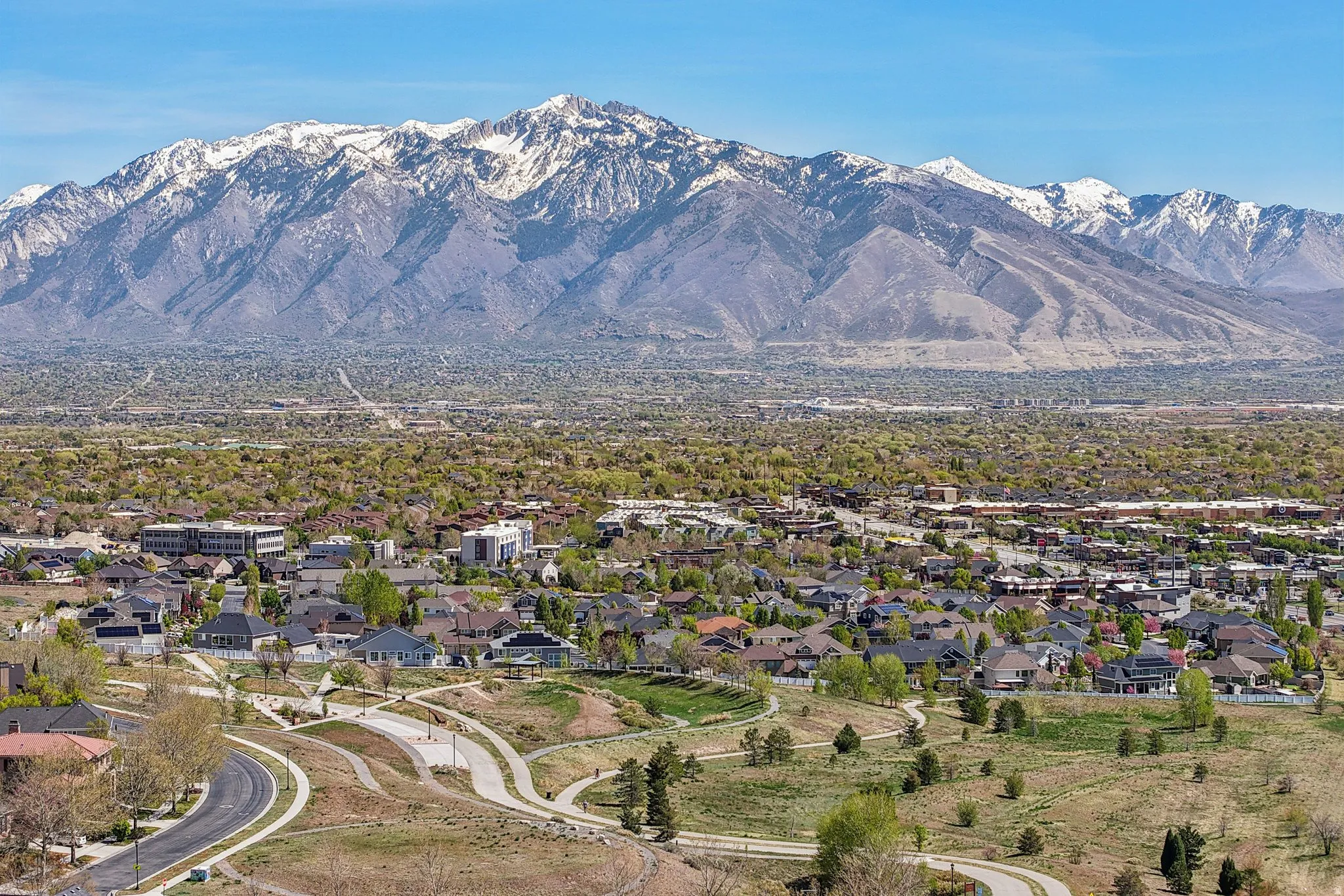 View of mountain background featuring nearby suburban area