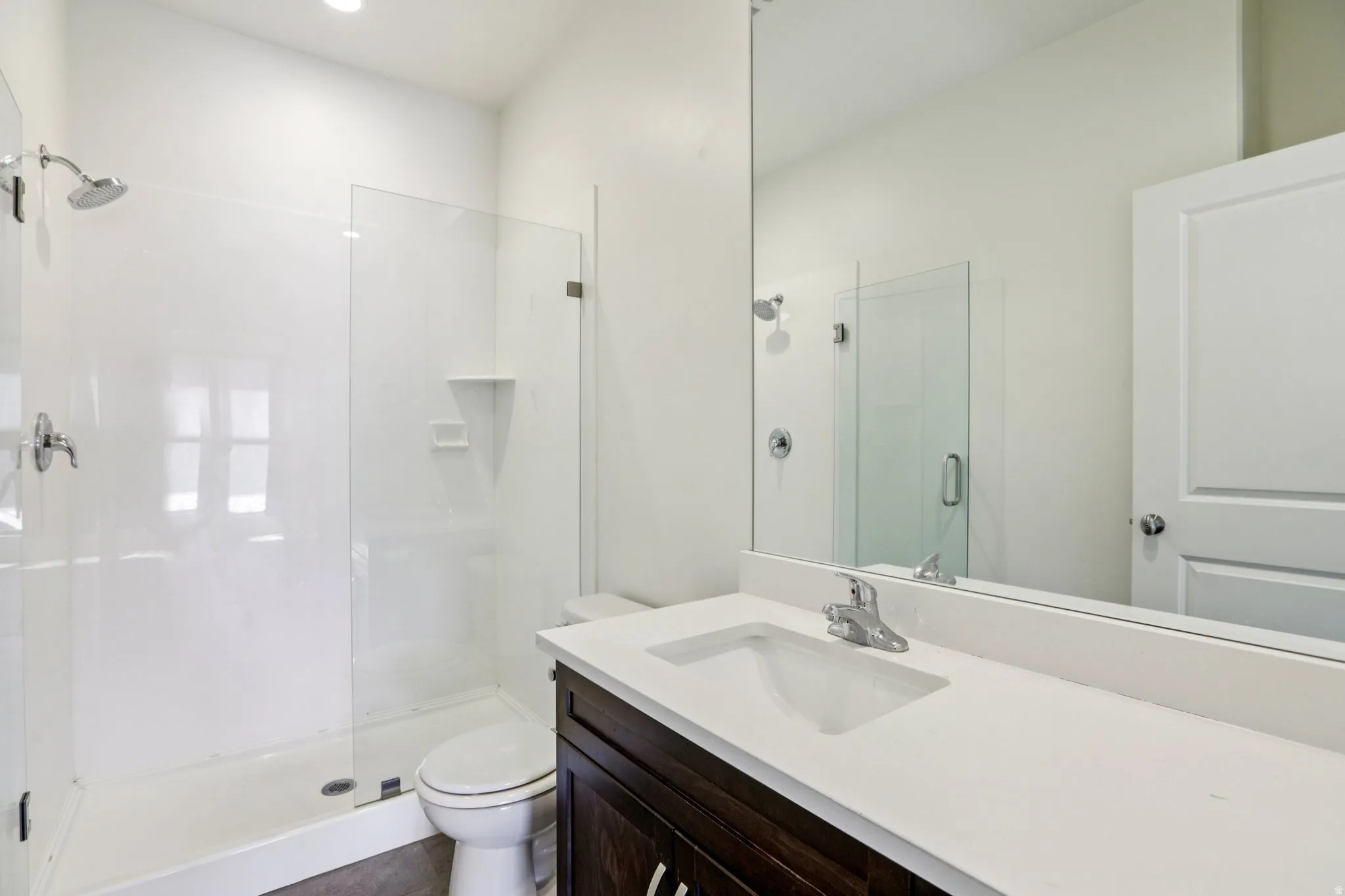 Bathroom with vanity and a stall shower