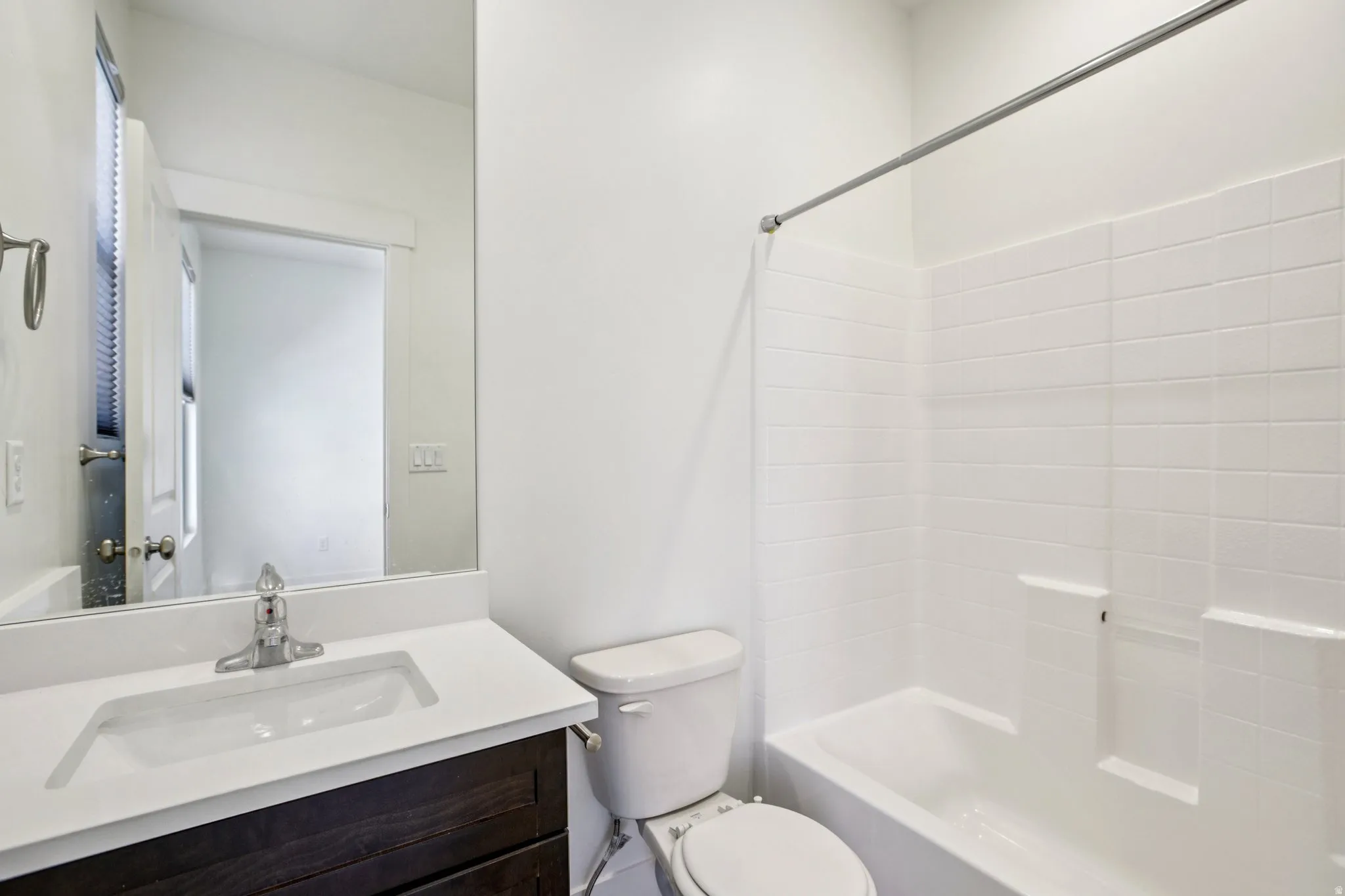 Full bathroom featuring vanity and bathtub / shower combination