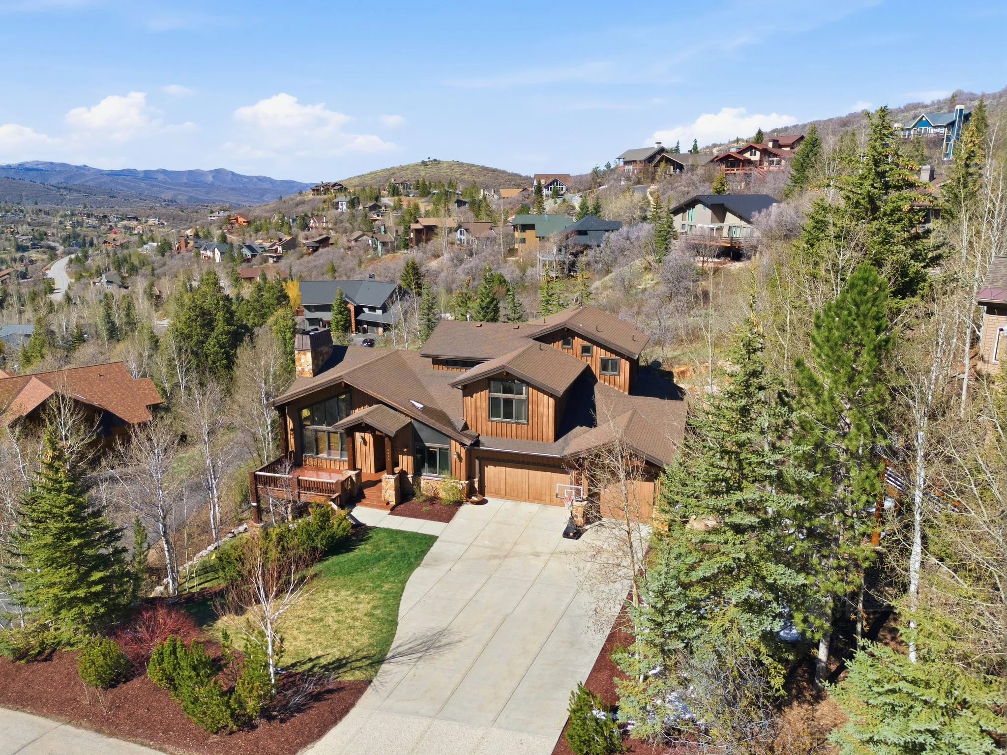 Aerial perspective of suburban area featuring a mountain backdrop
