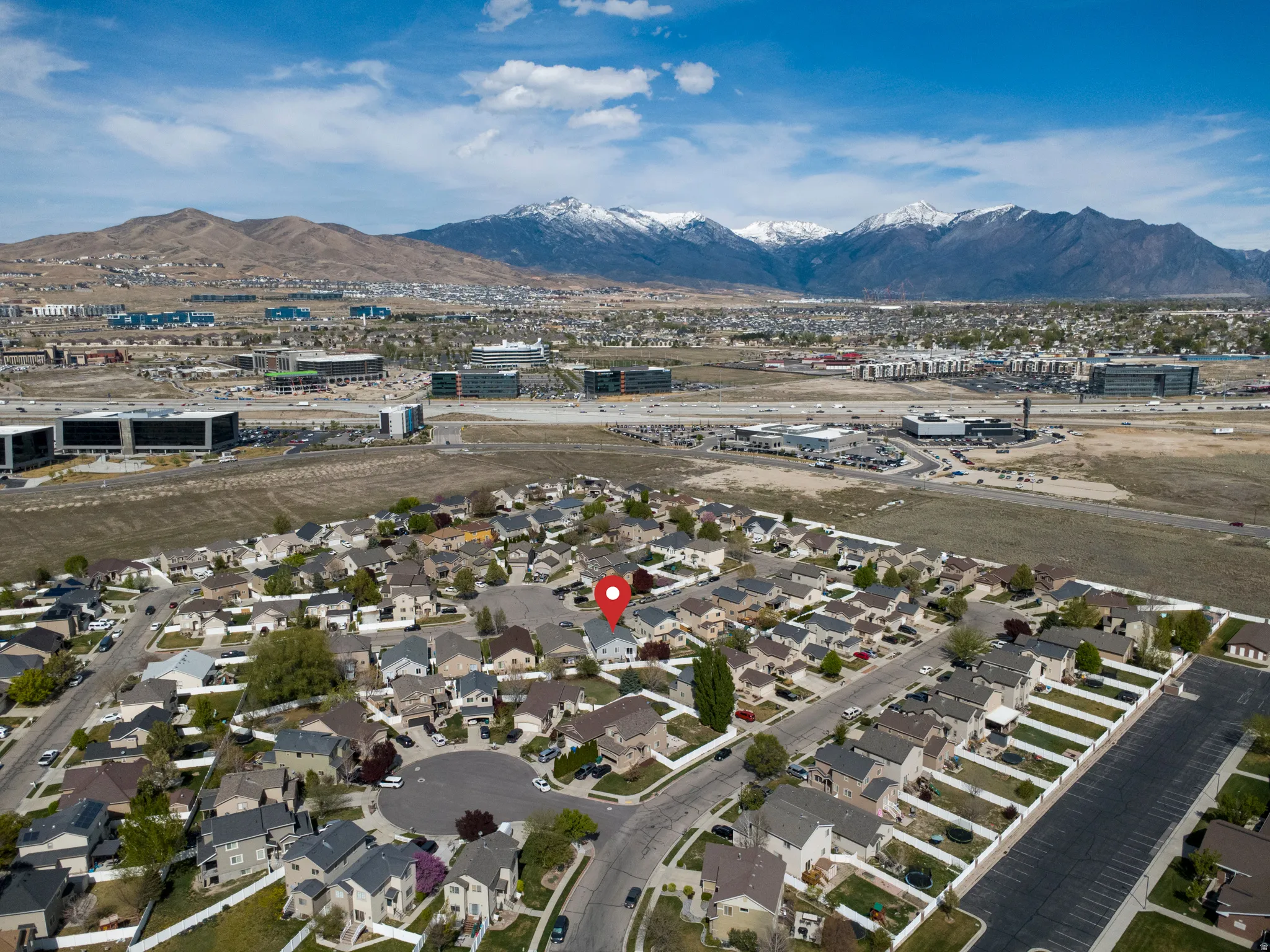 Aerial view of residential area with a mountainous background