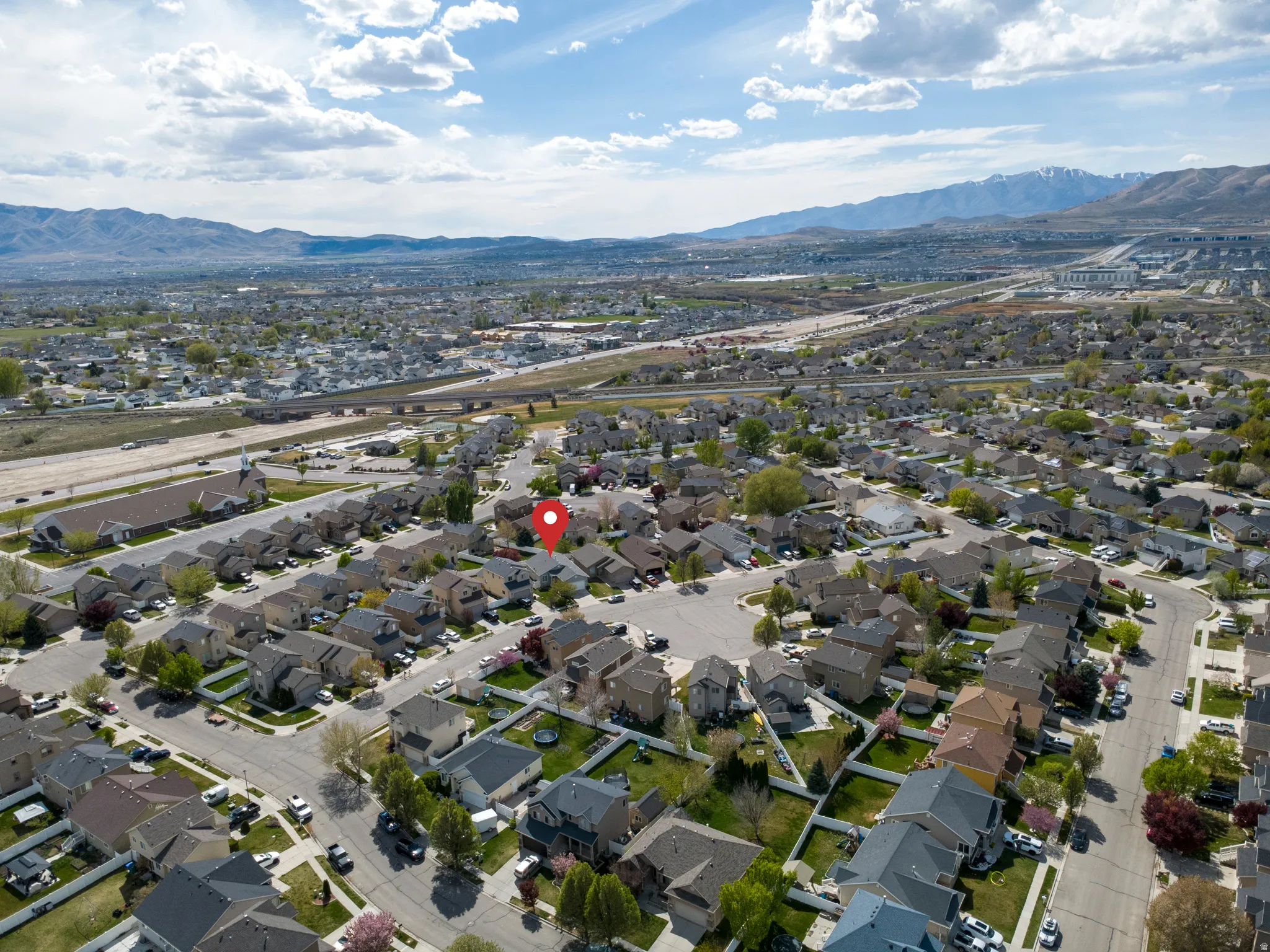 Aerial view of residential area with a mountain backdrop