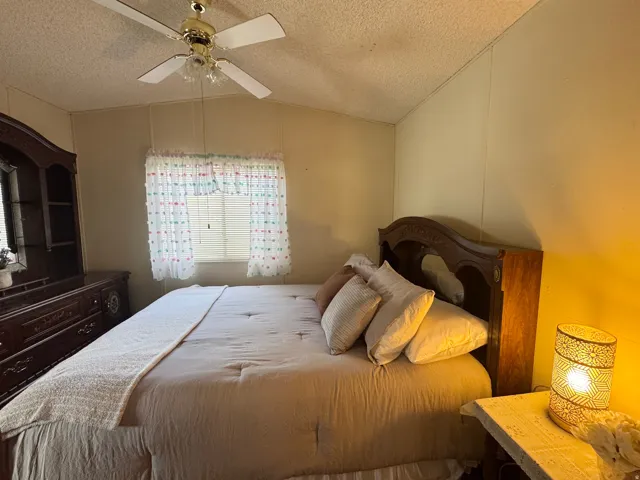 Bedroom featuring a ceiling fan