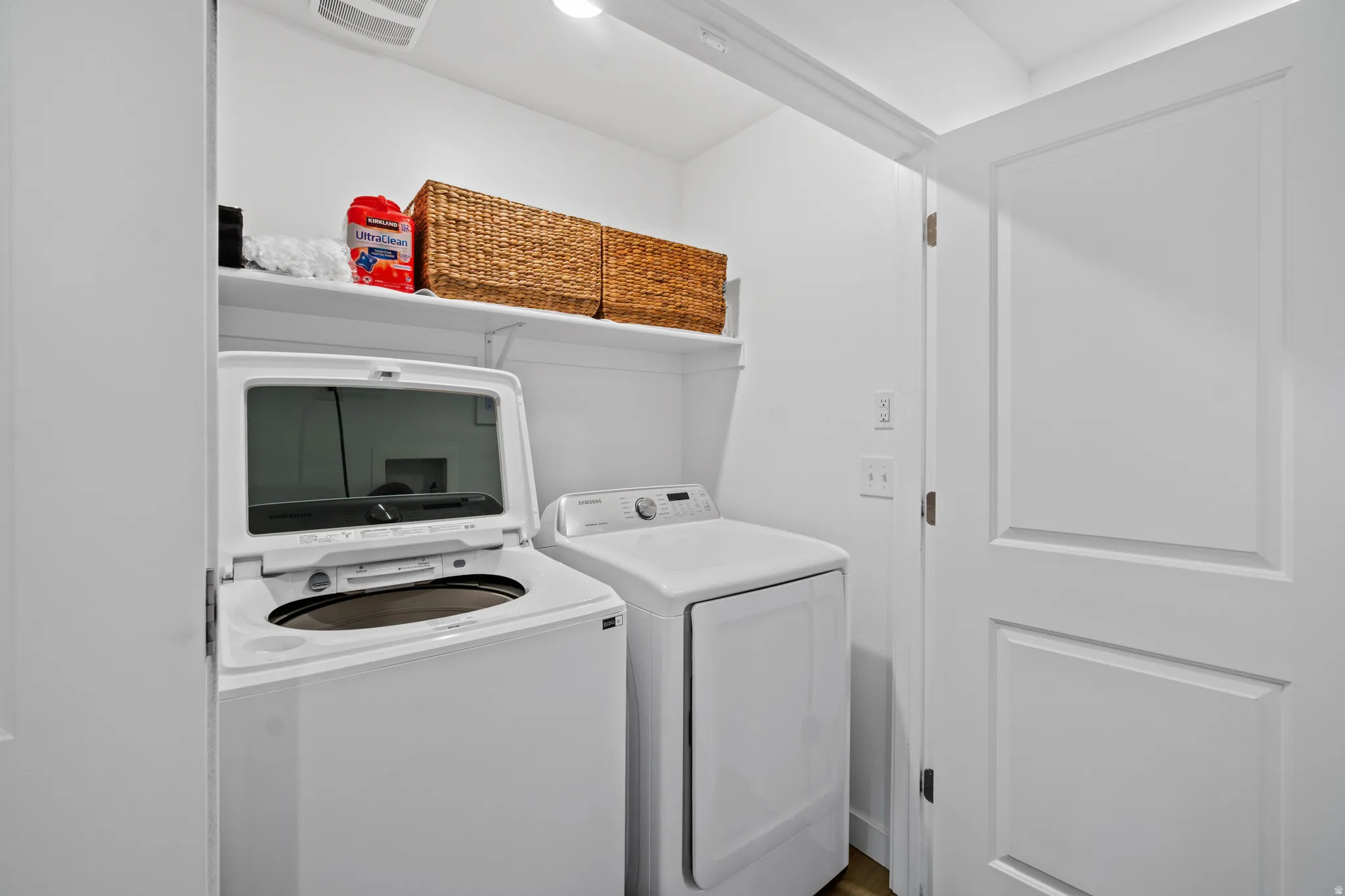 Laundry area with washing machine and clothes dryer