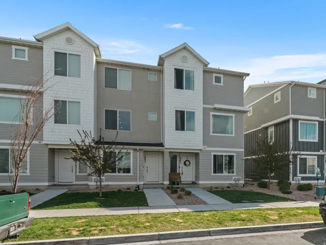 View of front of property with a front yard