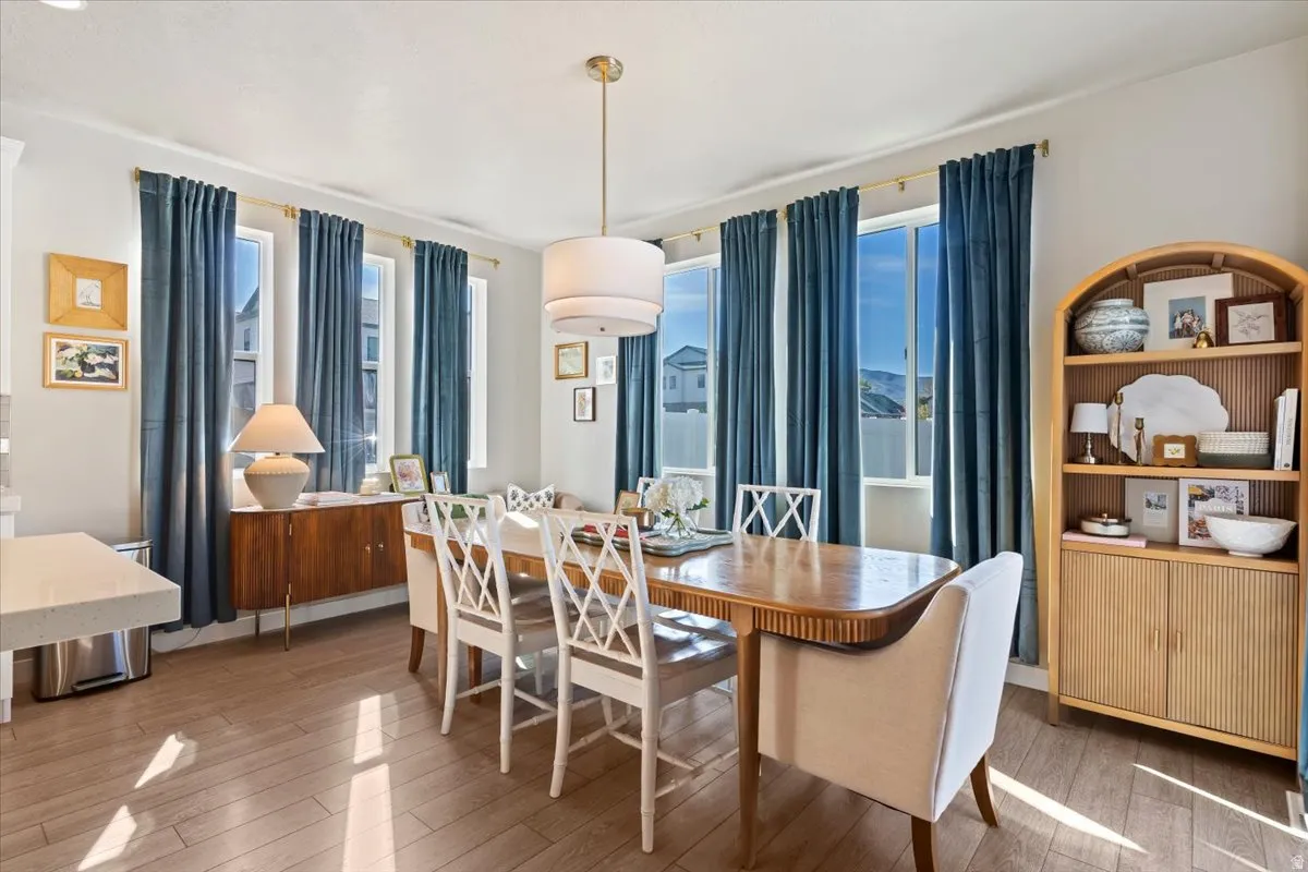 Dining area featuring wood-type flooring and baseboards