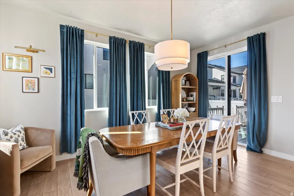 Dining area with light wood-style flooring