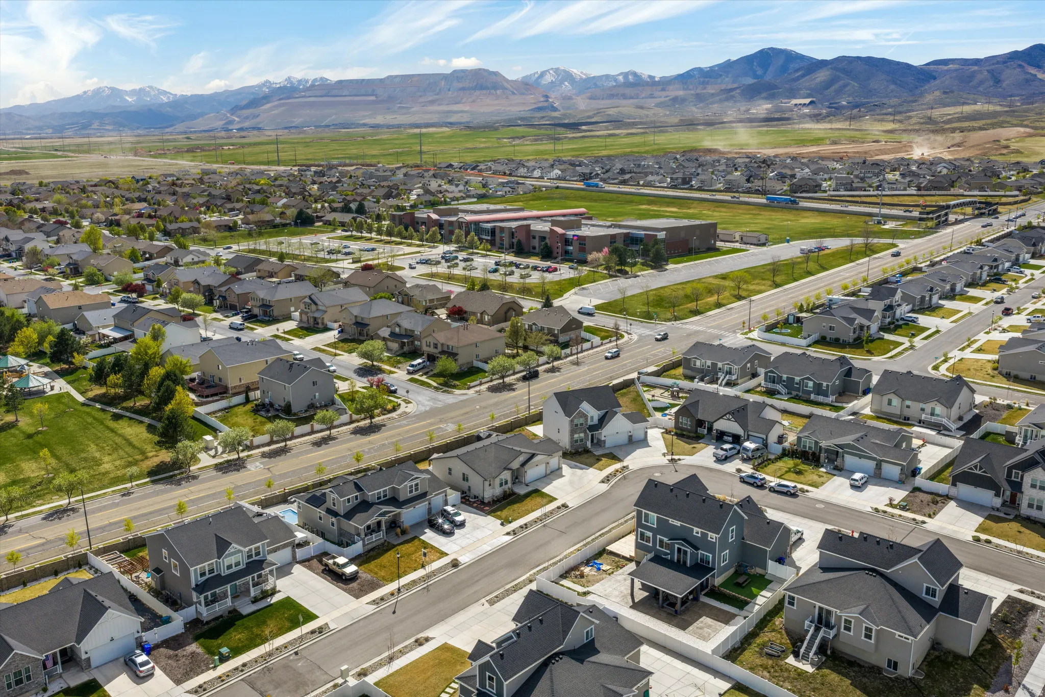 Aerial view of residential area featuring a mountainous background