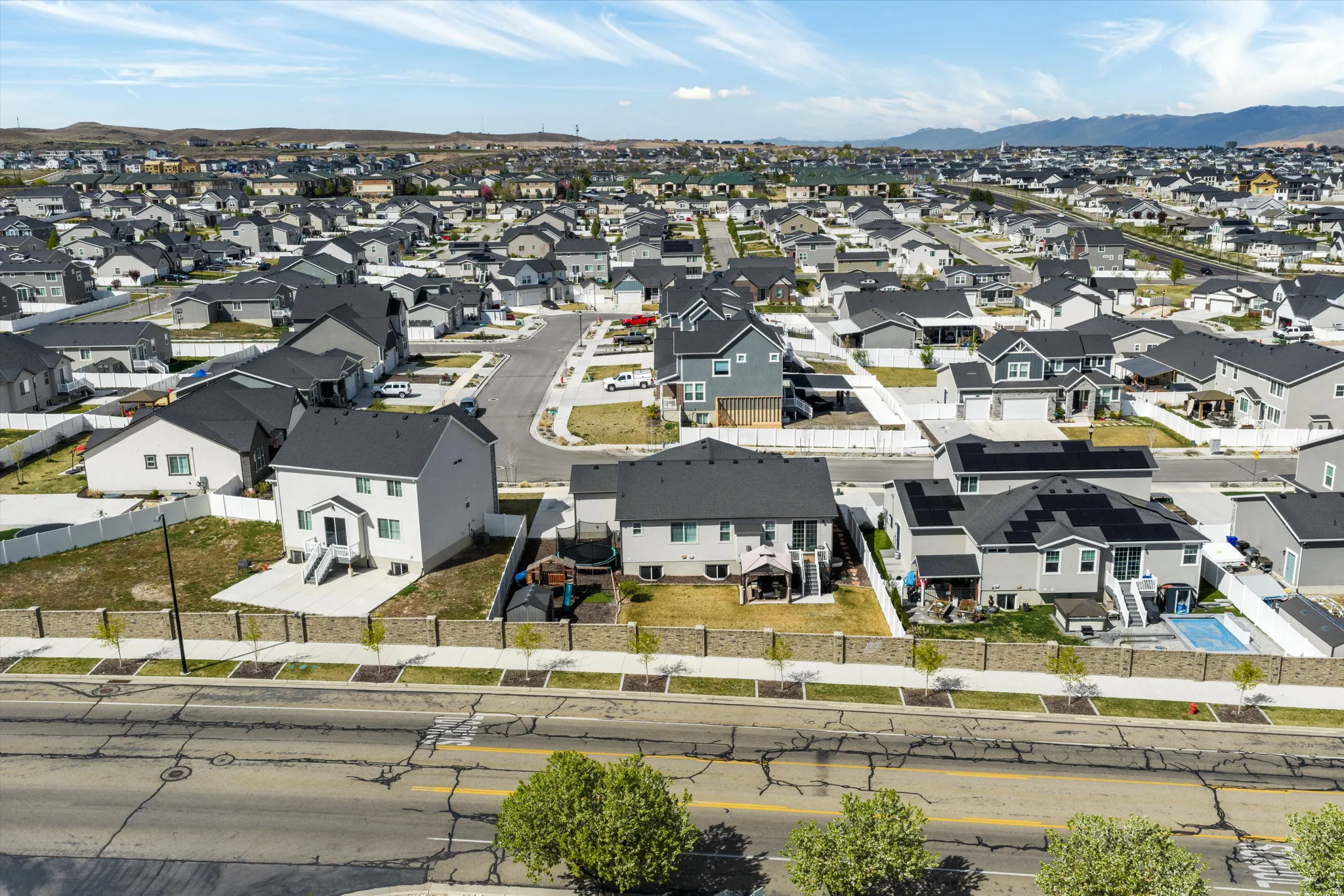 Aerial view of residential area featuring a mountainous background
