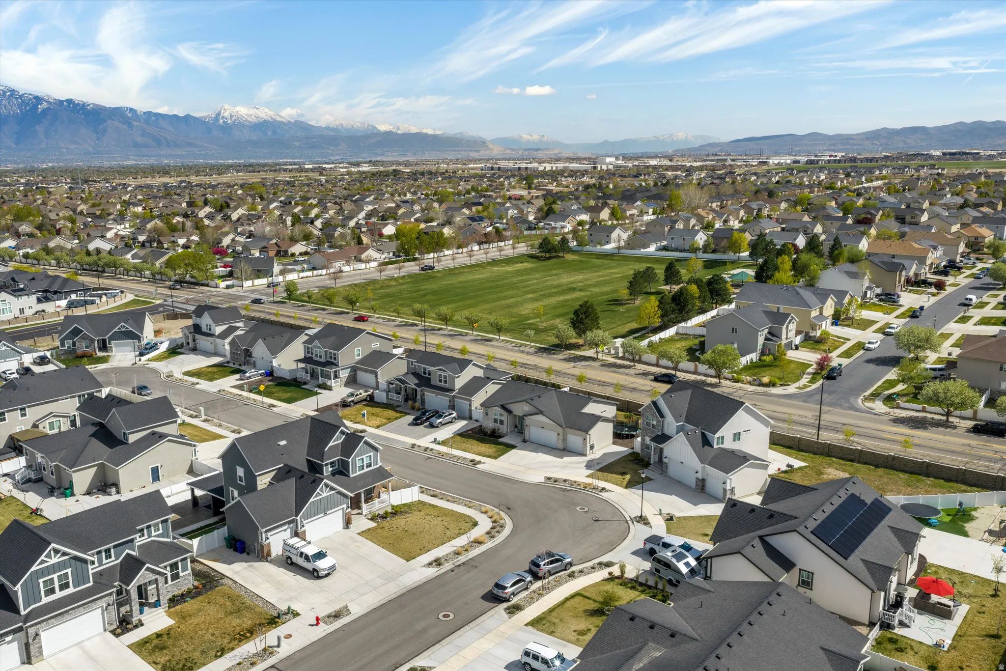 Aerial perspective of suburban area featuring a mountainous background