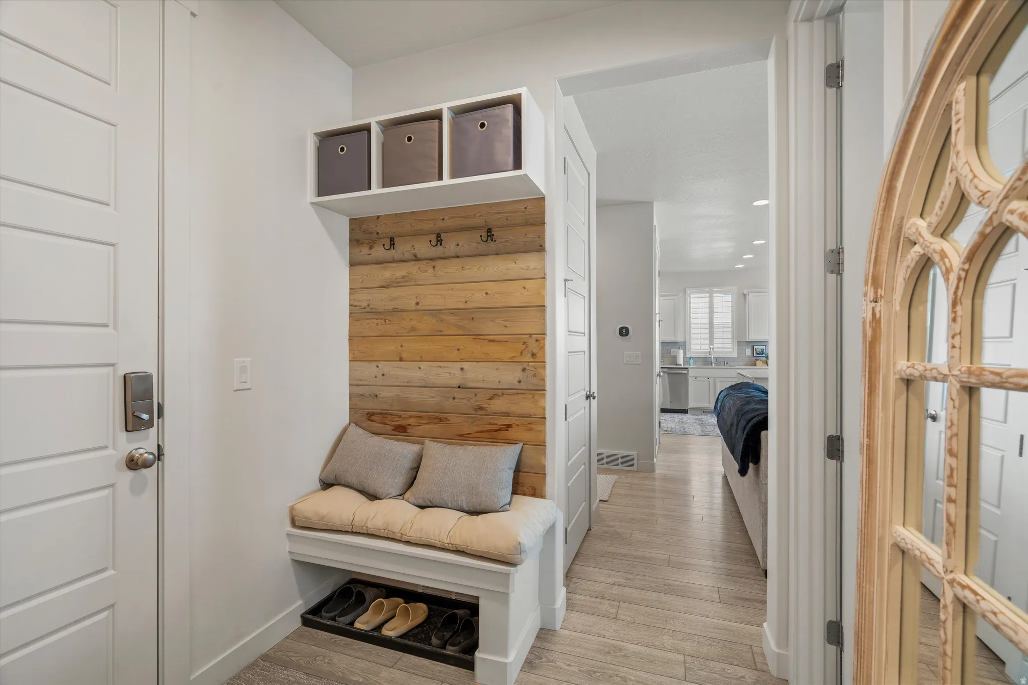Mudroom featuring light wood-type flooring and recessed lighting