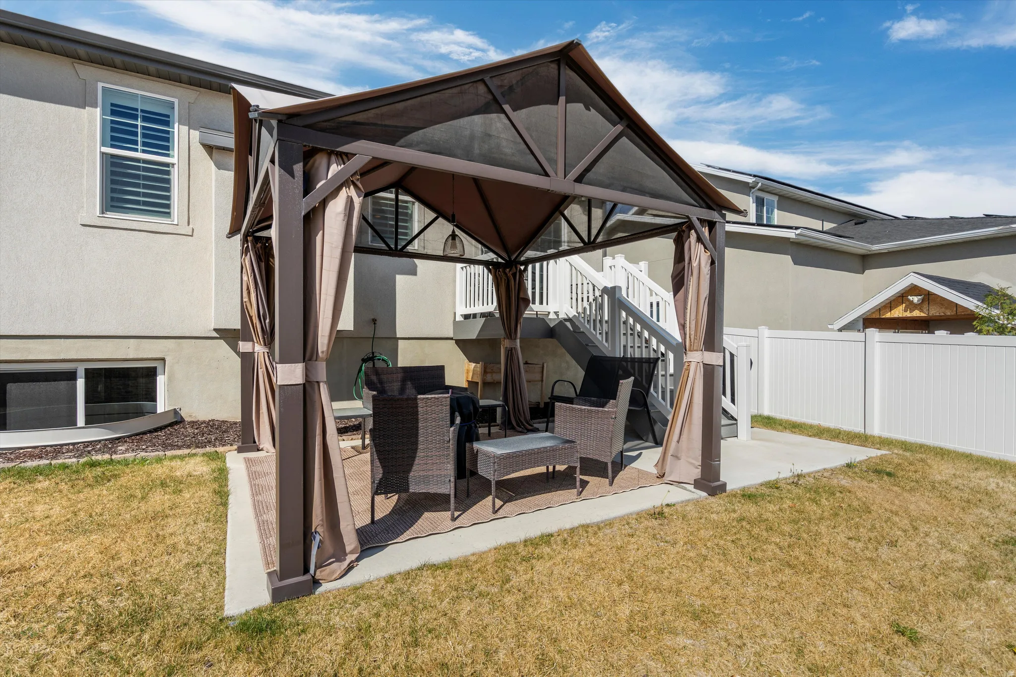 View of patio / terrace with a gazebo and stairs