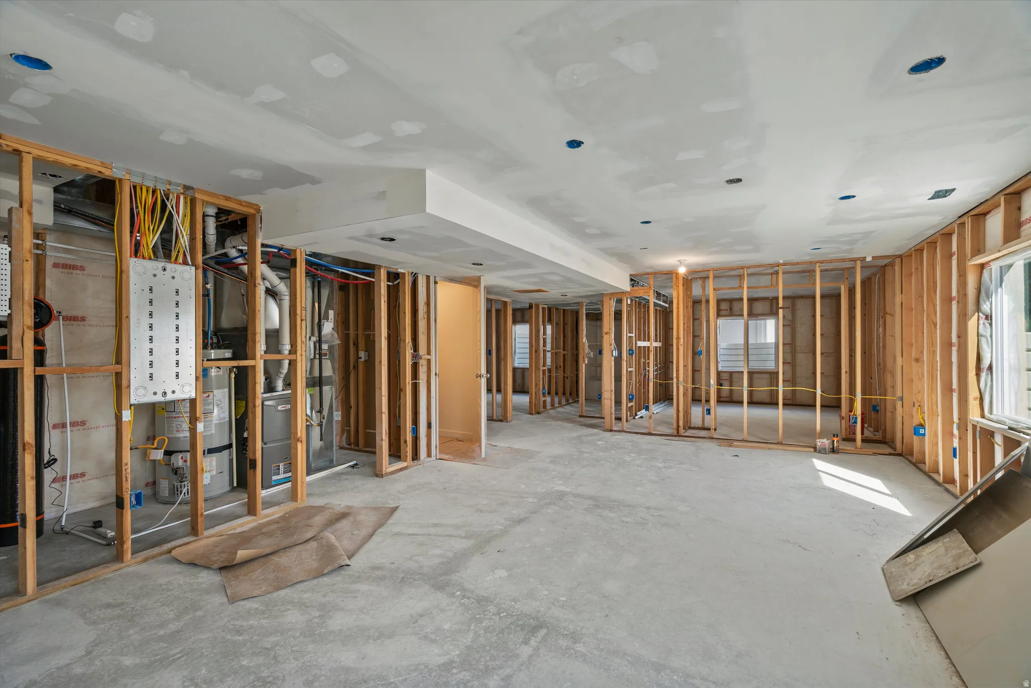 Misc room featuring water heater and heating unit