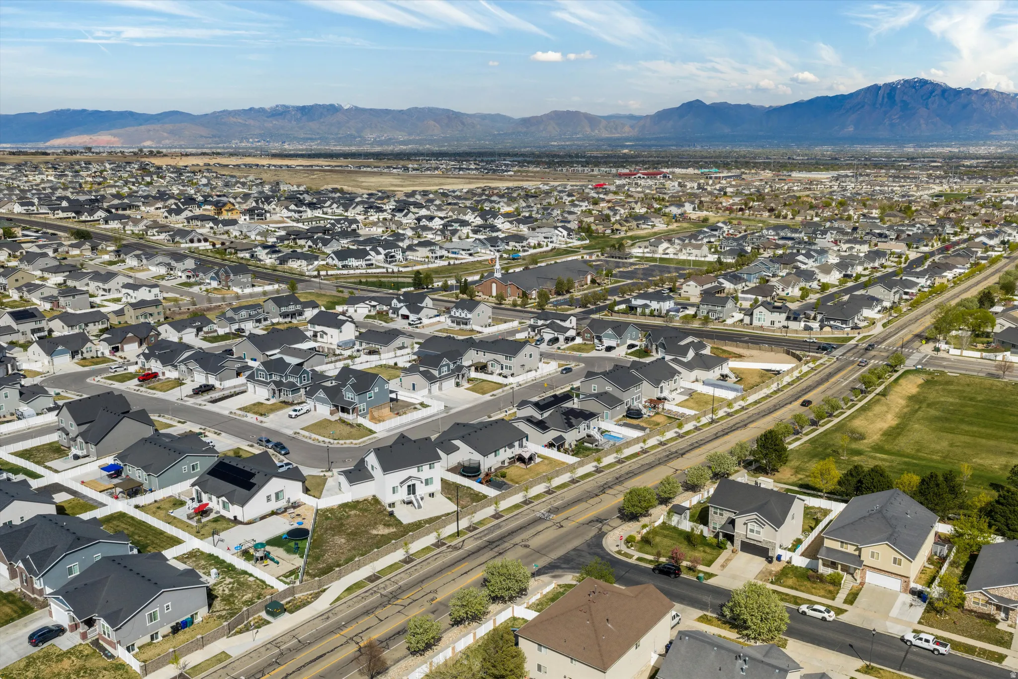 Aerial view of residential area featuring a mountain backdrop