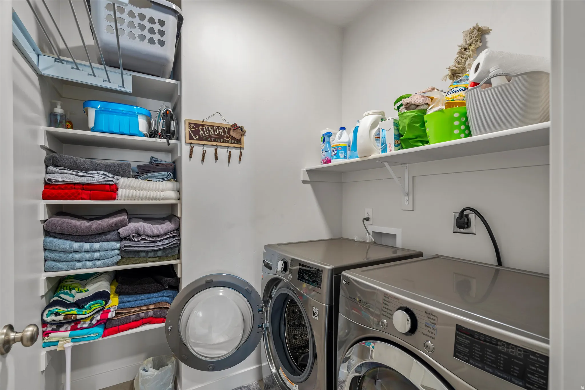 Laundry room featuring independent washer and dryer