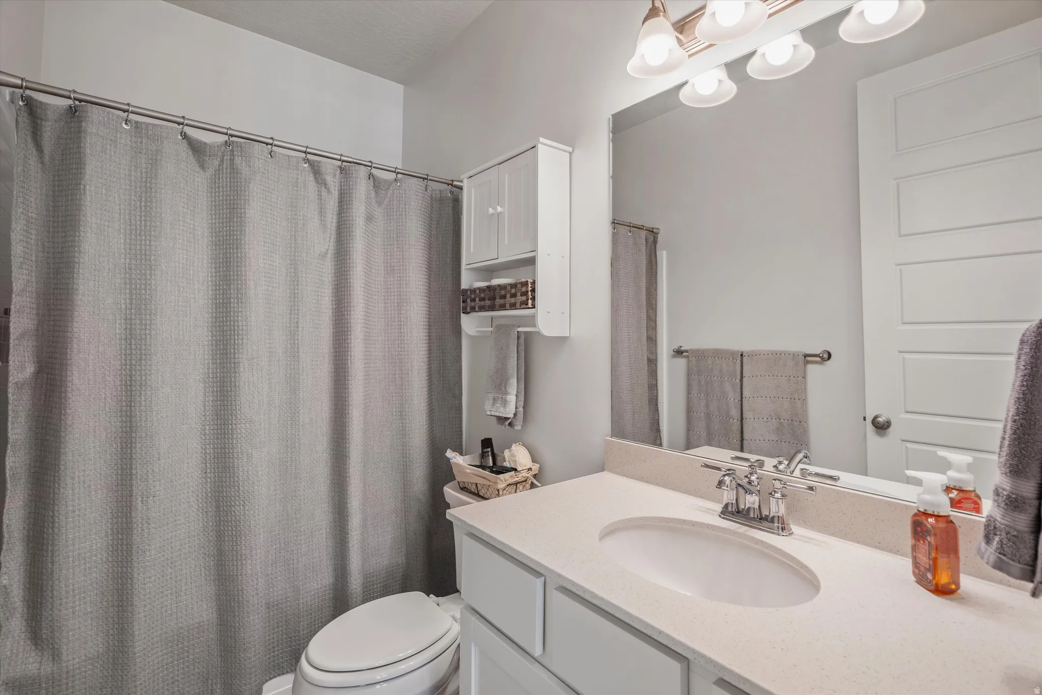Bathroom featuring vanity and a shower with curtain
