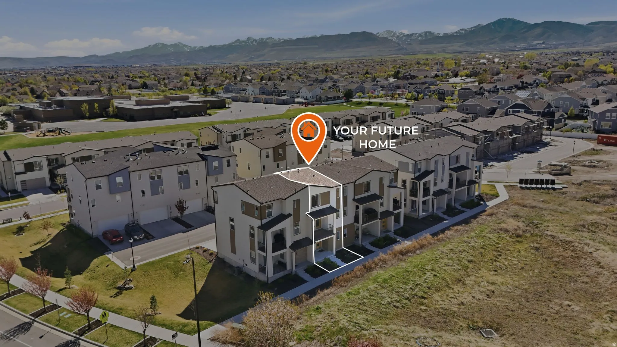 Aerial view of residential area featuring mountains