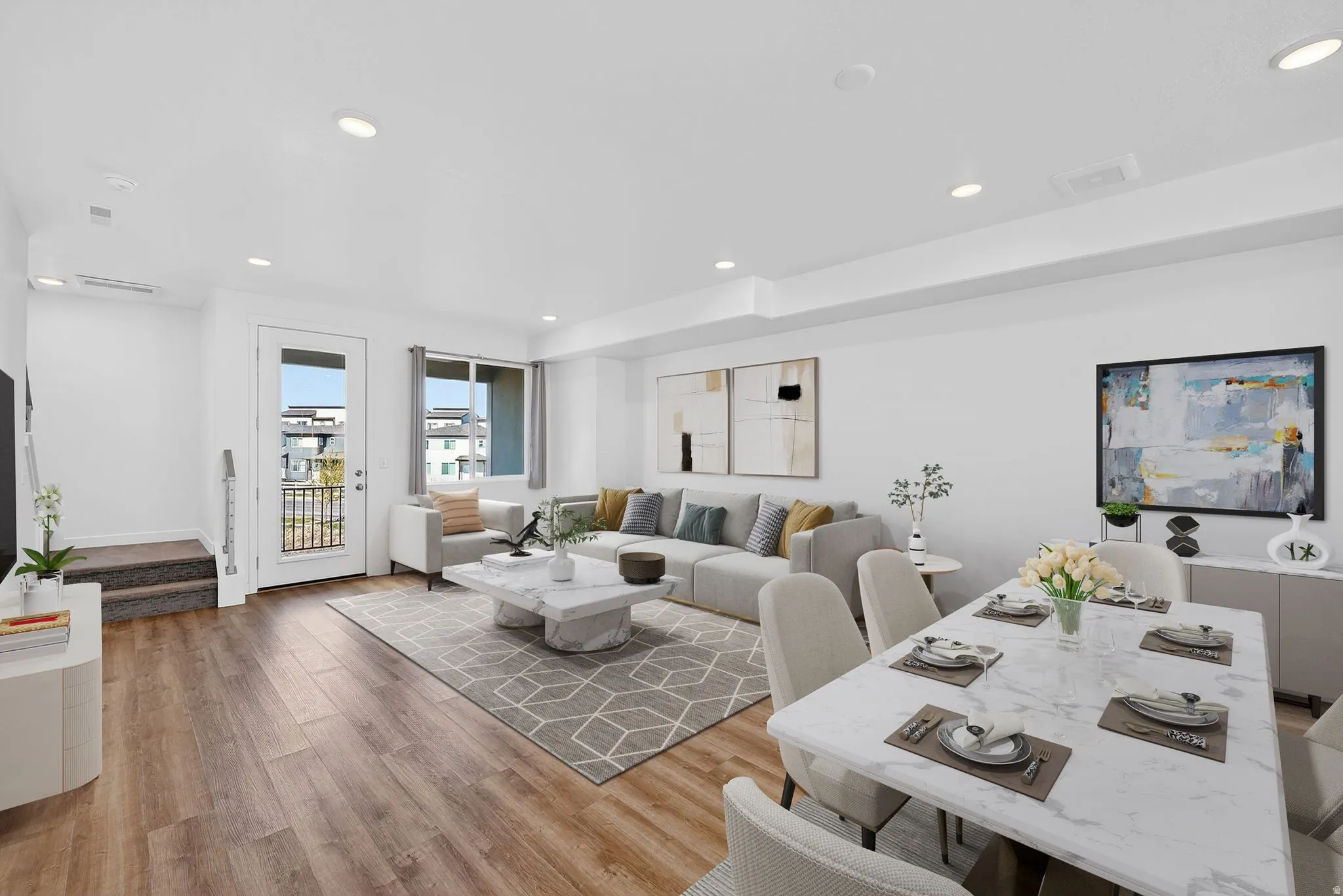 Living area featuring light wood-style floors and recessed lighting