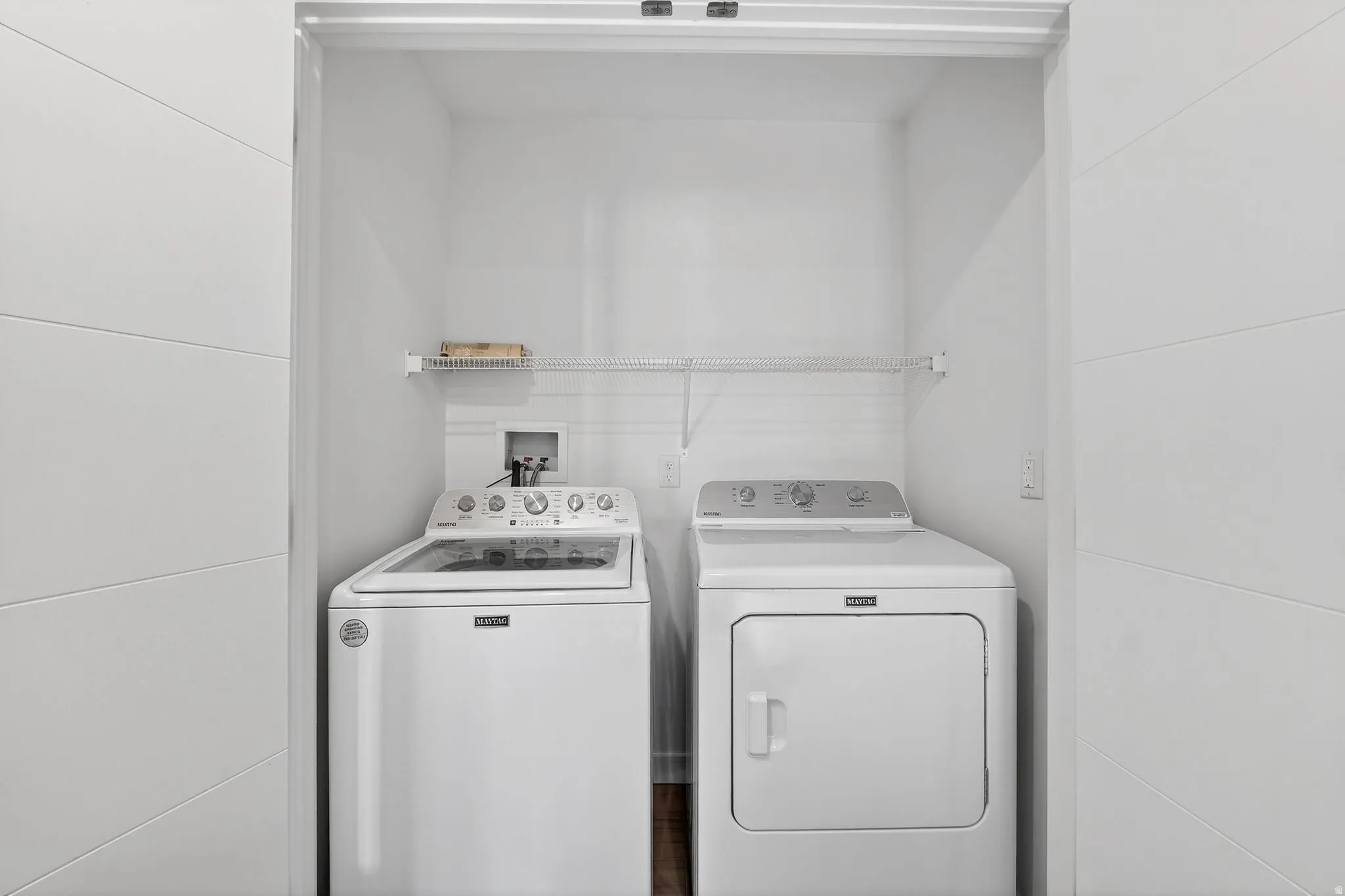 Laundry area featuring washing machine and clothes dryer
