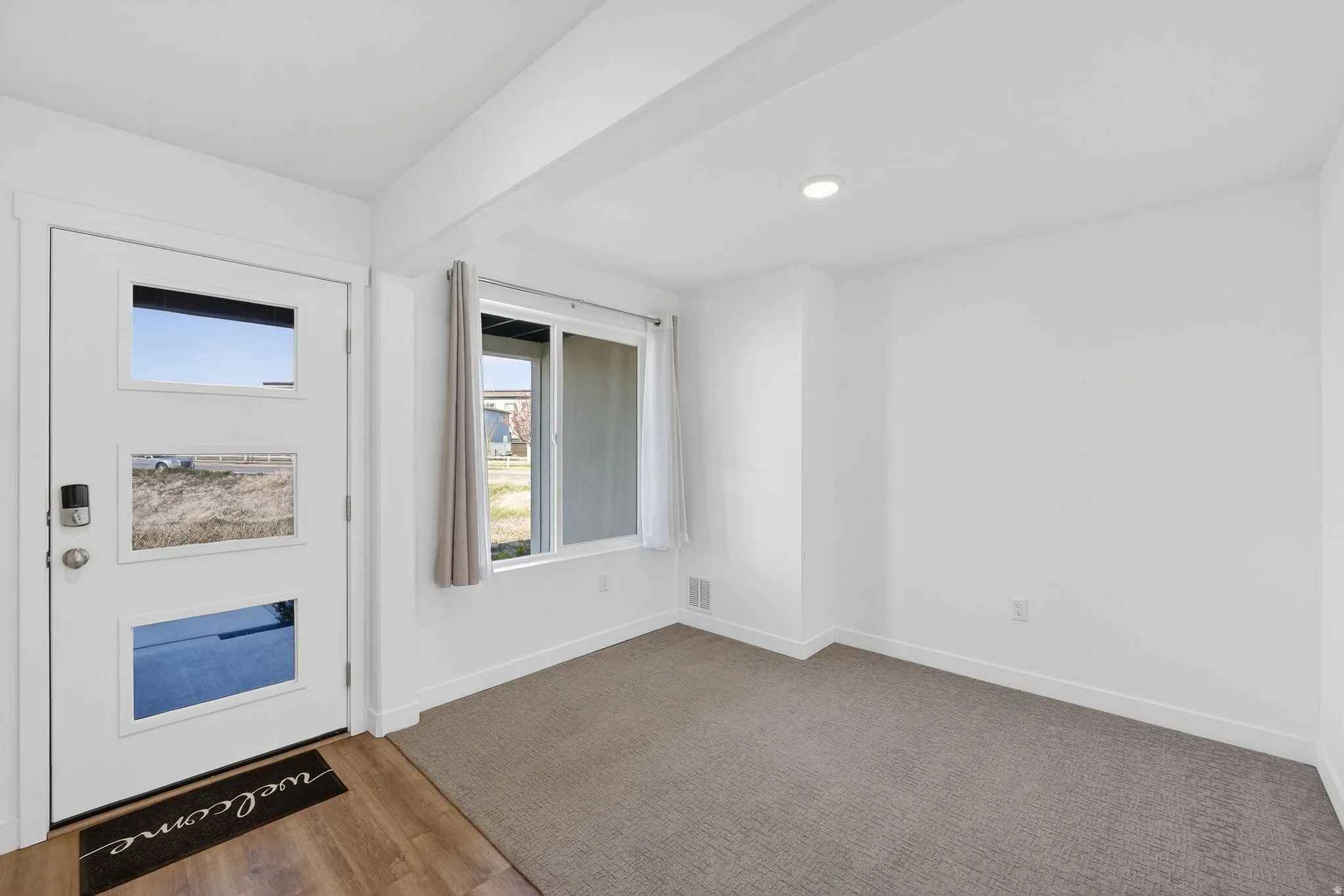 Entrance foyer featuring recessed lighting and light wood-style flooring