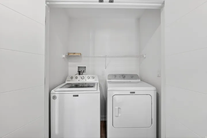 Laundry area featuring washing machine and clothes dryer