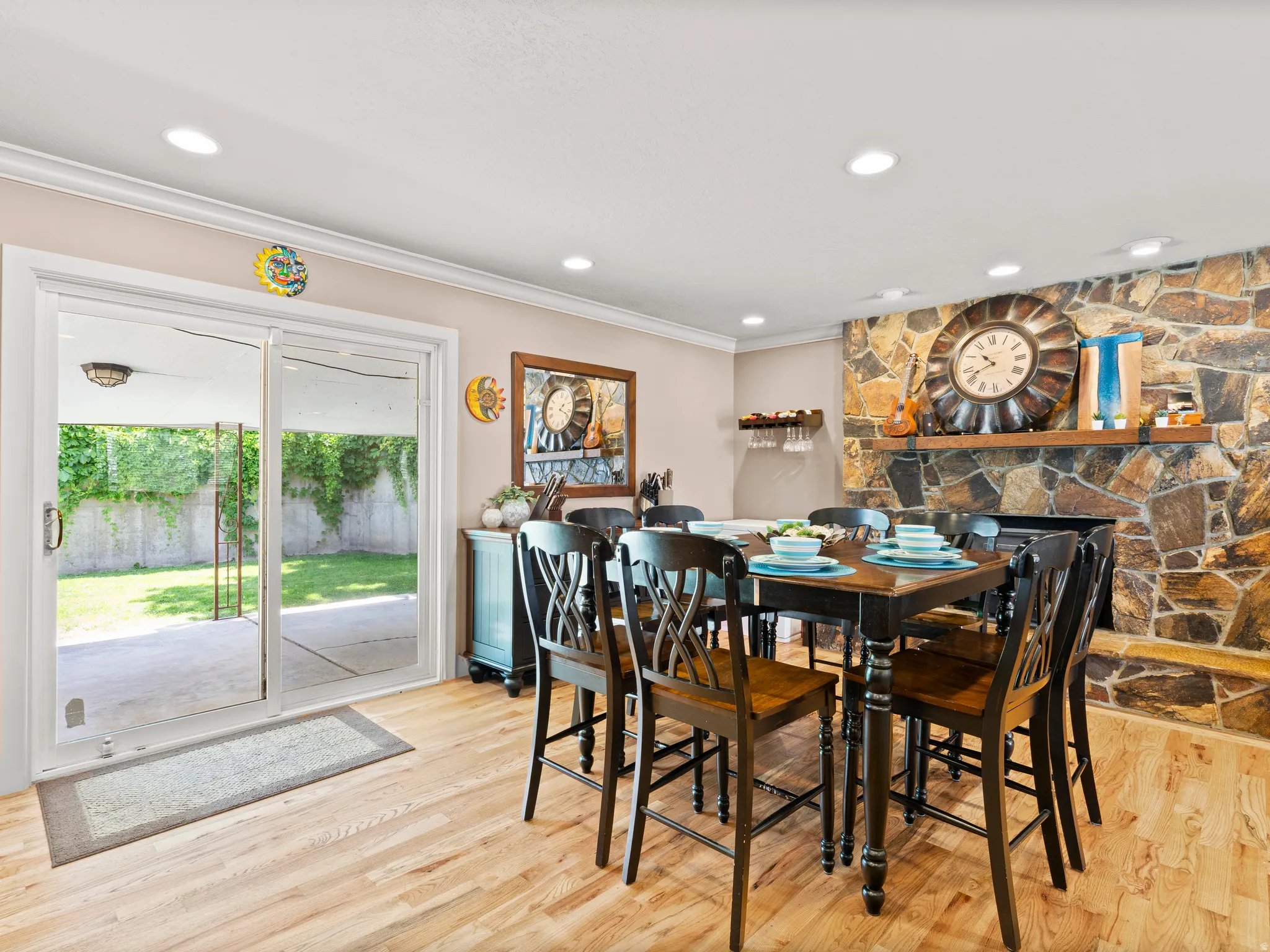 Dining room featuring crown molding, light wood-type flooring, and recessed lighting