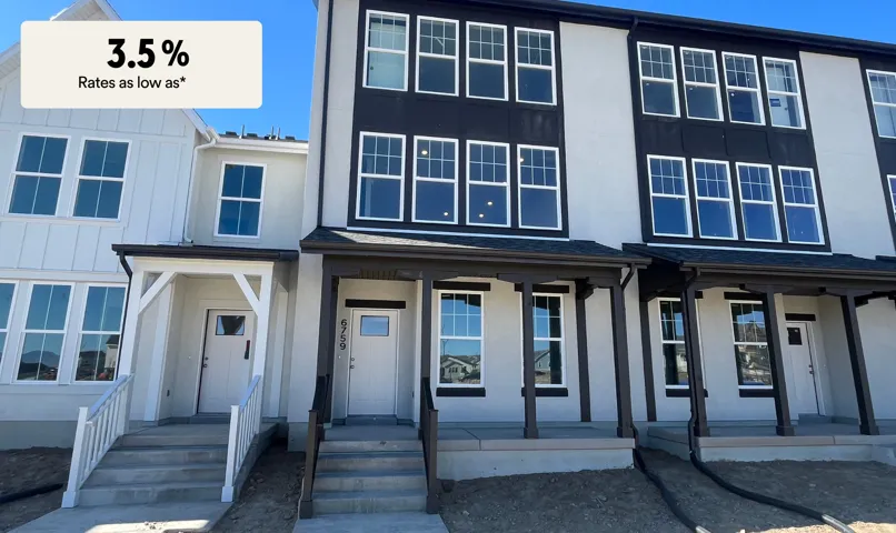 View of front of home featuring covered porch, roof with shingles, stucco siding, and board and batten siding