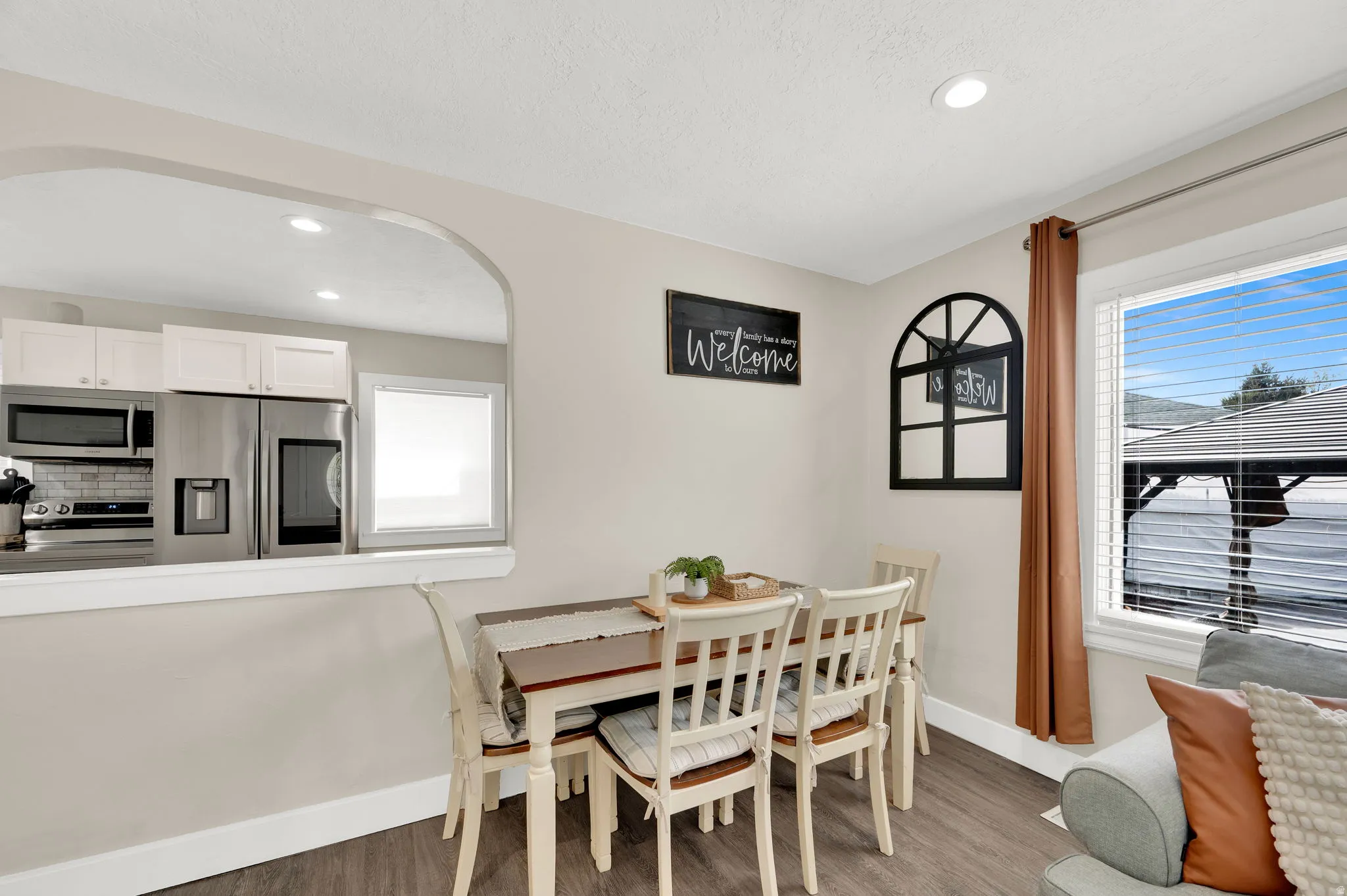 Dining area with recessed lighting and wood finished floors