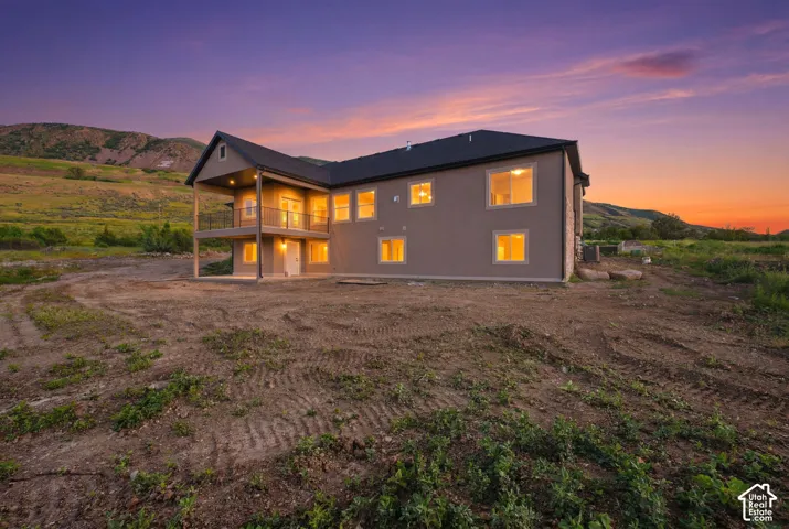 Contemporary two-story residence featuring a gray exterior finish and a dark shingle roof