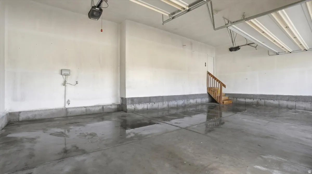 Garage featuring a garage door opener