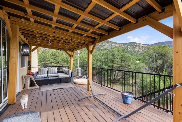 Wooden deck featuring outdoor seating and a mountain view