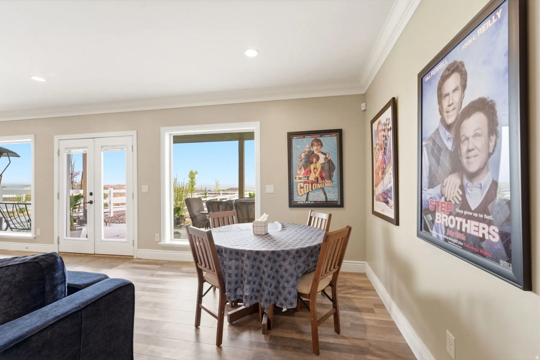 Dining room with french doors, crown molding, light wood-type flooring, and recessed lighting