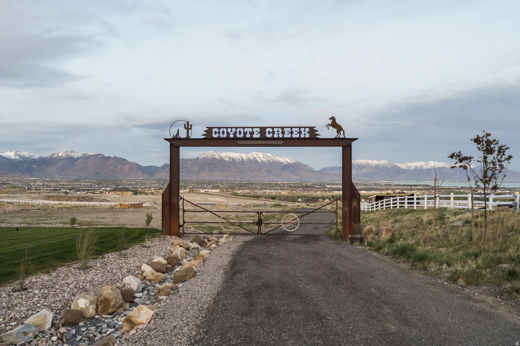 View of property's community featuring a gate and a mountain view