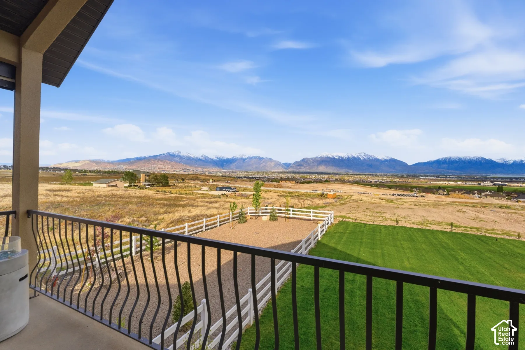 Balcony featuring a mountain view and a rural view