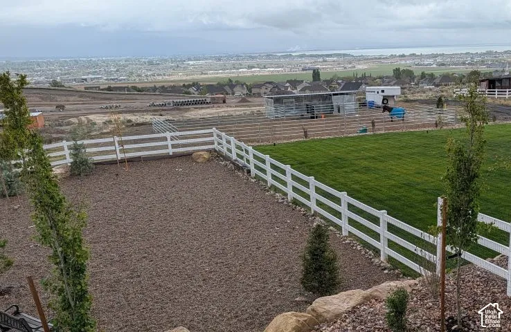 Fenced backyard with a rural view