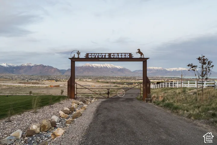 View of property's community featuring a gate and a mountain view