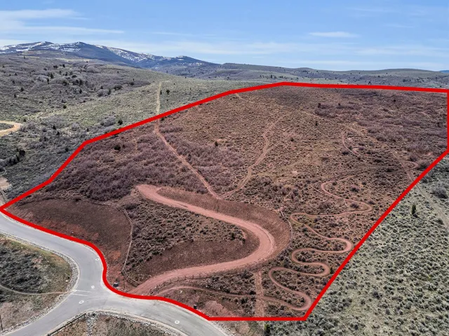 View of rural area with a mountainous background and property parcel outlined