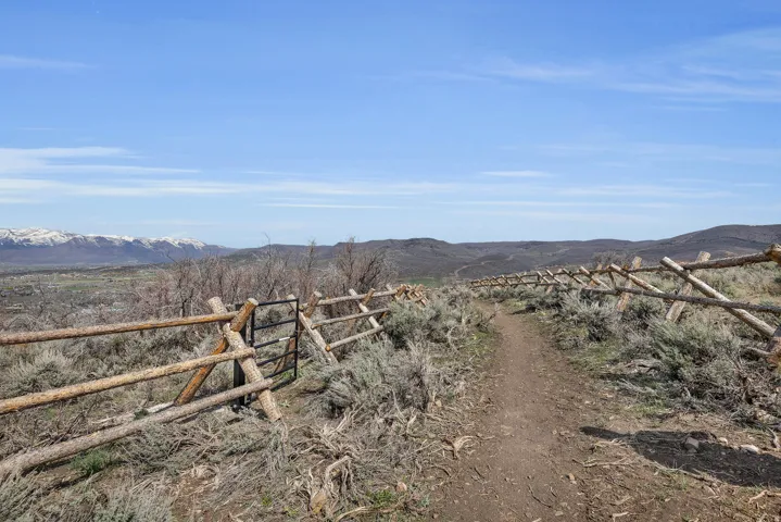 View of yard with a mountain view and a view of rural / pastoral area