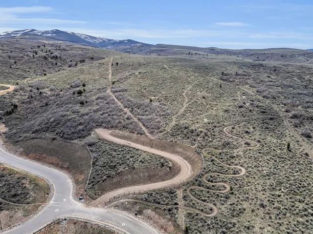 View of rural area featuring a mountainous background and a desert landscape